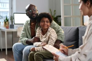 Happy Father and Son in Consultation with Lawyer